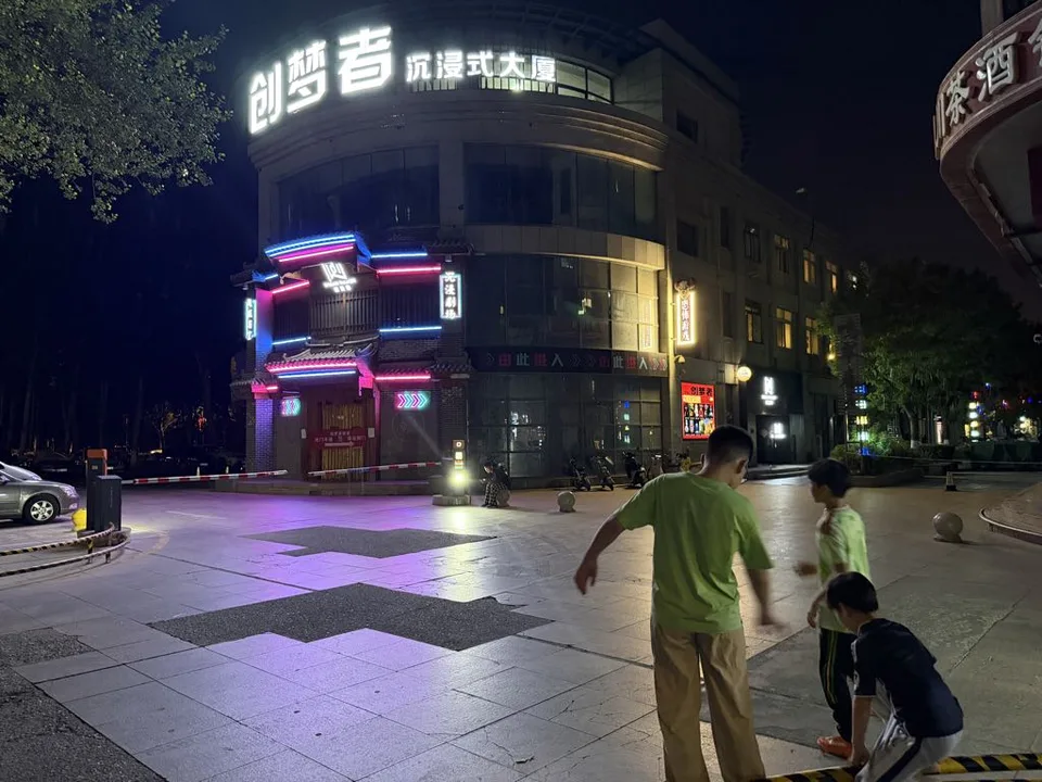 Night exterior of the immersive escape-room building on Shanghai West Road