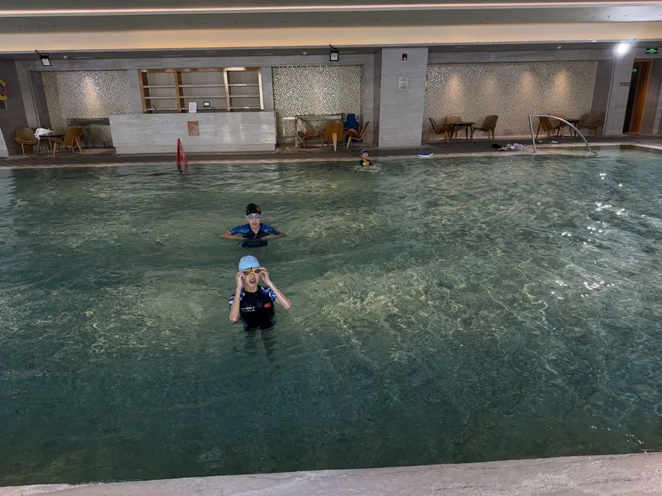 The family swimming in the indoor pool at JW Marriott Hotel Yinchuan